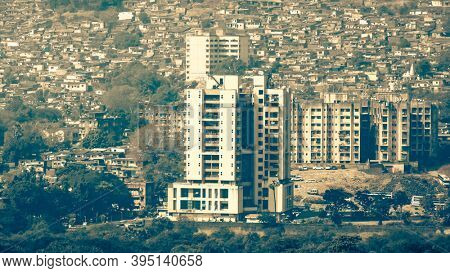 Mumbai, India - December 5, 2015 - Apartments and Slum view from Vikhroli in Mumbai, 54% of Mumbai population lives in the slums.