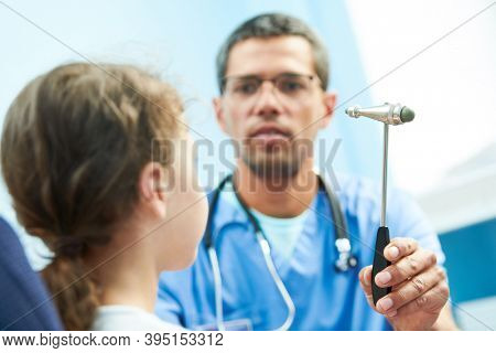 african doctor neurologist diagnoses little girl in clinic