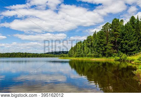 The Shores Of A Taiga Lake In Siberia. Lake Tagasuk, Russia