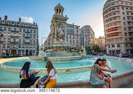 17 sep 2020, Lyon, France: Fountain at Jacobin square with relaxing people and tourists