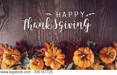 Thanksgiving Background Decoration From Dry Leaves And Pumpkin On Old Wooden Background. Flat Lay, T