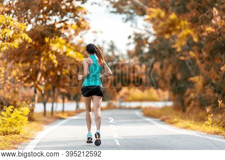 The Start Into The New Year 2021. Start Up Of Runner Woman Running On Nature Race Track Go To Goal O