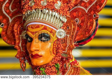 Payyanur, India - December 4, 2019: Theyyam artist perform during temple festival in Payyanur, Kerala, India. Theyyam is a popular ritual form of worship in Kerala, India