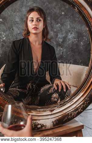Beautiful Young Lady In Black Jacket Sitting Afront Of The Vintage Mirror With Glass Of Wine Studio 