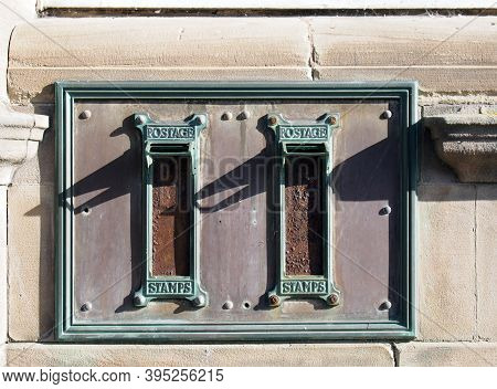 Old British Postal Mail Boxes With Rusted Letter Slots And Ornate Green Copper Frames With The Words