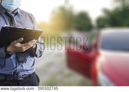 Asian Saleman Inspector Checking Writing On Clipboard Change Wheels In Garage Of Dealership Mechanic