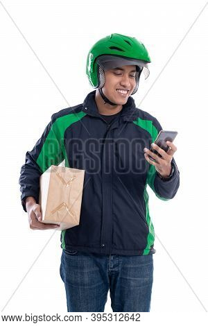 Male Courier With Package And Using Smartphone Isolated