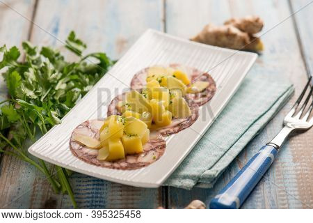 octopus carpaccio with potatoes parsley and ginger