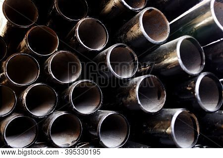 Black Metal Pipes And Adapters Of Different Diameters For Gasification Or Water Supply. Industrial B