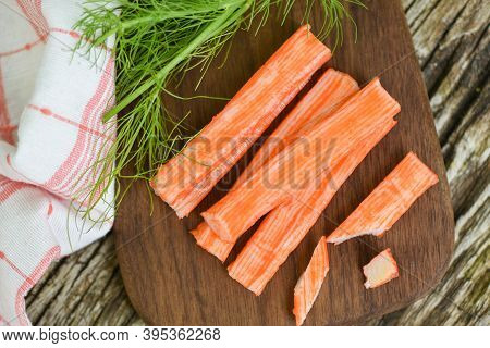 Crab Sticks On Wooden Cutting Board And Vegetable , Fresh Crab Sticks Surimi Ready To Eat Japanese F