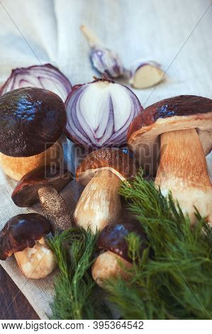 Crop Of Fresh Delicious Porcini Mushrooms On Wooden Background Ready For Cooking. Boletus Edulis (va