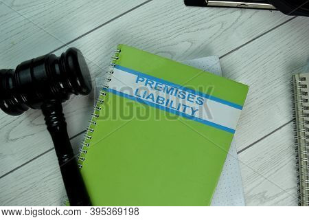 The Book Of Premises Liability On Office Desk.