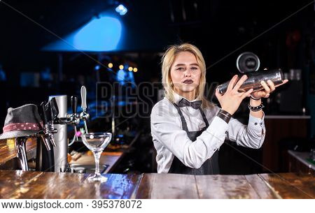 Girl Bartender Makes A Cocktail At The Pothouse