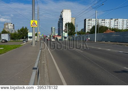 Multi-lane Highway In The City. A Road With Multi-storey Buildings.