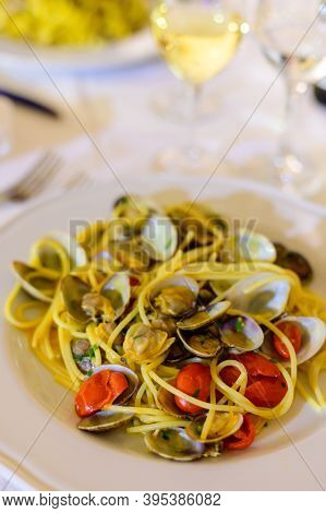 Frech Homemade Spaghetti Pasta With Vongole Sea Sheels And Small Red Tomatoes Close Up