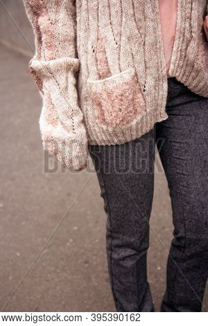 Woman In A Cozy Nude Cardigan Spends Time Outdoors. Close Up. Without Face, Noface