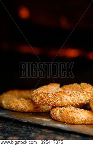 Freshly Baked Simit Baked Goods With Sesame Seeds Close-up (turkish Bagel - Gevrek Or Kuluri) In Fro