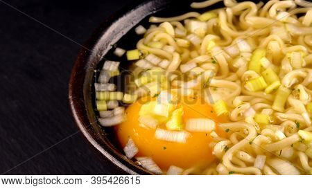 A Noodle Soup With Egg And Leek.