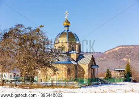 Beautiful Winter Landscape With Orthodox Church And Mountains