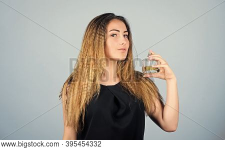 Be Impossible To Forget. Girl Applying Perfume. Eau De Toilette. Getting Fresh. Woman With Bottle Of