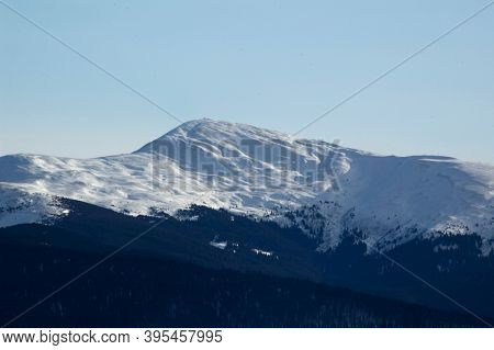 Winter morning. Snowy mountains. Winter