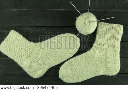 Warm And Beautiful Socks Knitted Of Woolen Threads. Hand Tied Socks. Knitting As A Hobby And A Quara