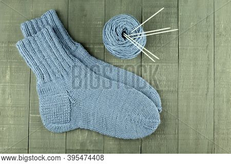 Warm And Beautiful Socks Knitted Of Woolen Threads. Hand Tied Socks. Knitting As A Hobby And A Quara