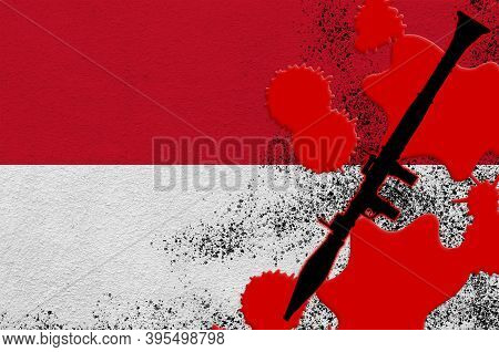 Monaco Flag And Black Rpg-7 Rocket-propelled Grenade Launcher In Red Blood. Concept For Terror Attac