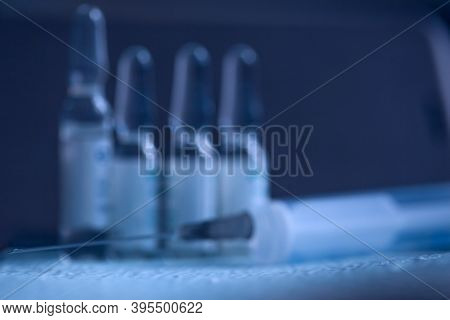 Blurry Medical Blue Background. Syringe And Medicine. Syringe And Ampoules Medical Concept.
