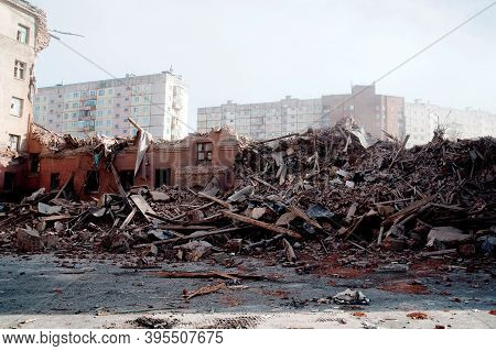 Blurred Image Pile Of Demolition Rubble. Gray Rubble At A Building Site. Demolition Of A House. Conc