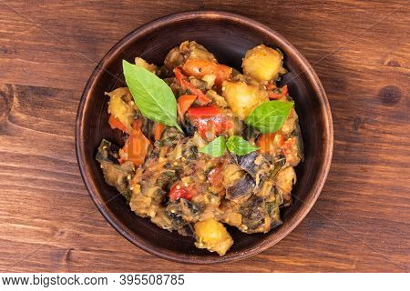 Italian Vegetable Stew With Potatoes, Eggplants, Tomatoes, Pepper In A Rustic Clay Plate, Decorated 