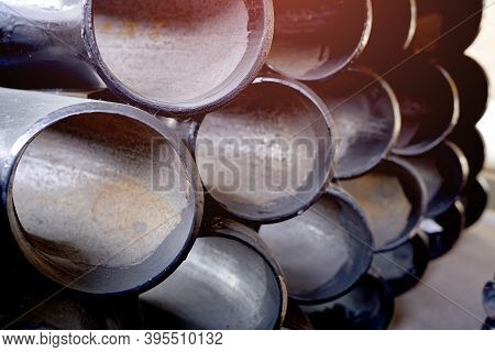 Black Metal Pipes And Adapters Of Different Diameters For Gasification Or Water Supply. Industrial B