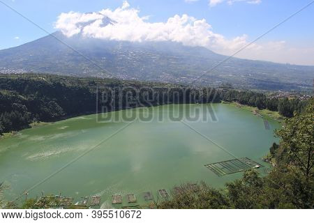 The Beauty Of Menjer Lake Against The Background Of Mount Sindoro. Tourist Destination \'hill Of Lov
