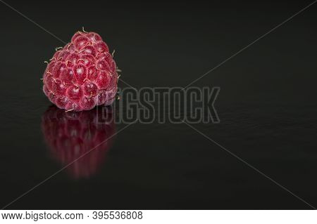 Raspberry Closeup. Isolated On Black. Macro Berry Of Red Raspberries On A Black Background