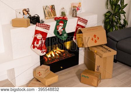 Kyiv, Ukraine - November 16, 2020: Boxes Nova Poshta With Delivery Of Christmas Gifts Lie Near The F