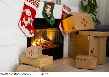 Kyiv, Ukraine - November 16, 2020: Boxes Nova Poshta With Delivery Of Christmas Gifts Lie Near The F