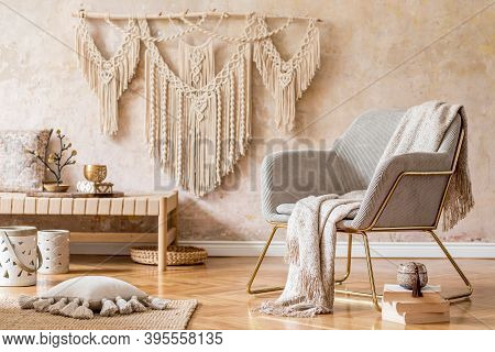 Stylish Oriental Living Room With Design Armchair, Beautiful Macrame, Carpet, Decorations And Elegan