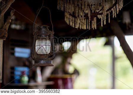 Old Rusty Indian Style Lantern. Vintage Old Lanterns Hanging. Old Style Burning Lantern Hanging Form