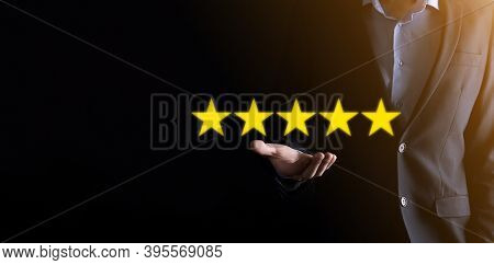 Man Hand Showing On Five Star Excellent Rating.pointing Five Star Symbol To Increase Rating Of Compa