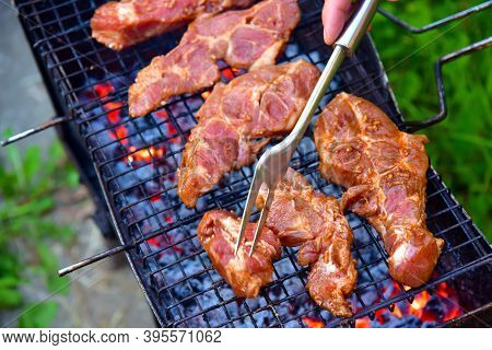 Delicious Steak Perfectly Cooked On Grill. Cooking Meat On The Grill. Fried Food Over Charcoal. Barb