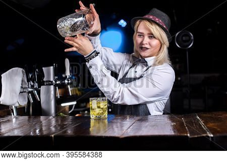 Girl Bartender Creates A Cocktail On The Brasserie