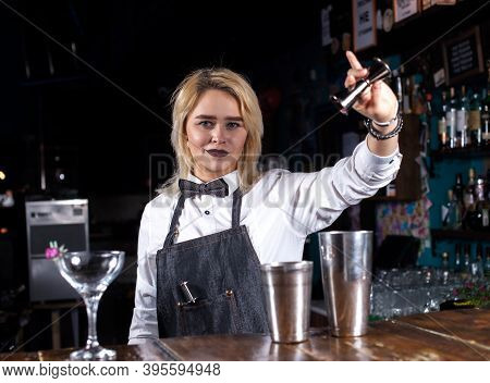 Girl Bartender Creates A Cocktail In The Porterhouse