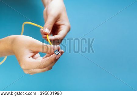 Womans Hands Hold Sc And Fc Connector Fiber Optic Patch Cord Single Mode On Blue Background