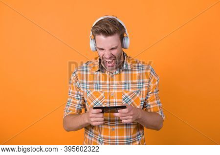 Involved In Gaming. Get Music Subscription. Man Satisfied Listen Music Modern Headphones And Smartph