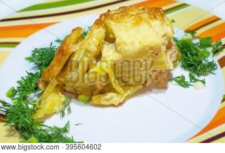 Dauphinoise Potato Gratin With Herbs On A Plate