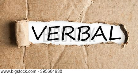 Verbal, Text On White Paper On Torn Paper Background