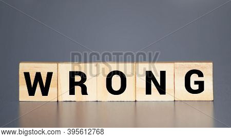 Wrong - Word From Wooden Blocks With Letters, Incorrect False Wrong Concept, Random Letters Around B