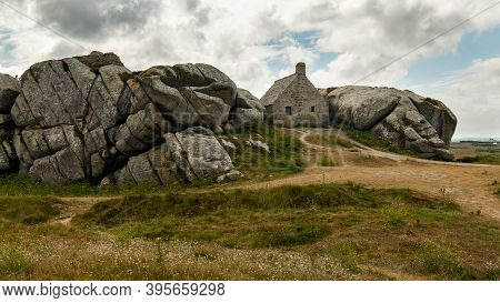 House Between Rocks In Meneham On The Atlantic Coast In Northern Brittany (france), Cloudy Day In Su