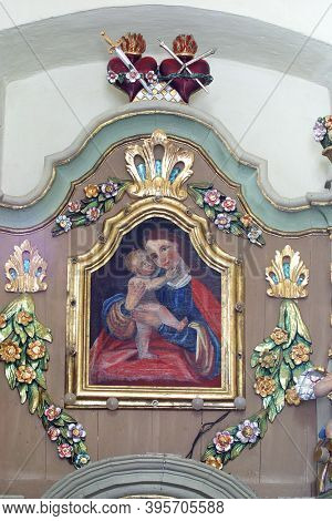 SVETI PETAR MREZNICKI, CROATIA - JULY 14, 2013: Virgin Mary with baby Jesus, altarpiece at the altar Our Lady of Sorrows at St. Peter's Parish Church in Sveti Petar Mreznicki, Croatia