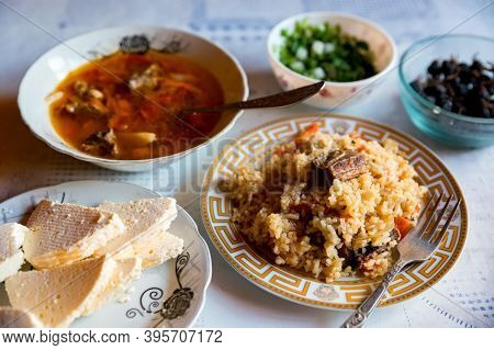 Close Up Of Chorba Soup, Homemade Cheese And Pilaff In A Plate As Balkar Lunch